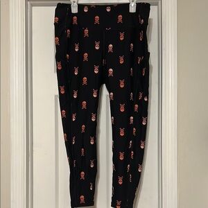 Torrid Black and Pink Skull Leggings with pockets size 2